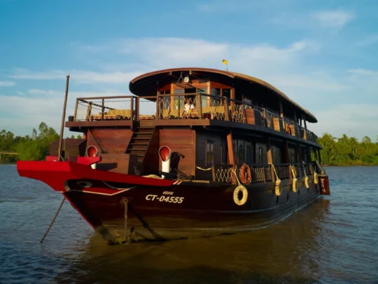 Mekong Smile Bassac Cruise Cai Be Can Tho traditional wooden river cruise sailing on the Mekong River