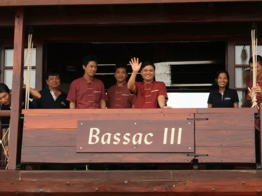 Mekong Smile Bassac Cruise Can Tho Bassac crew welcoming guests on deck