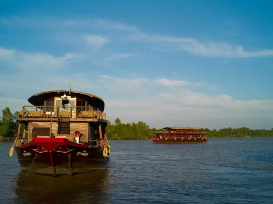 Mekong Smile Bassac Cruise Can Tho Bassac Cruise sailing on the Mekong River under blue sky