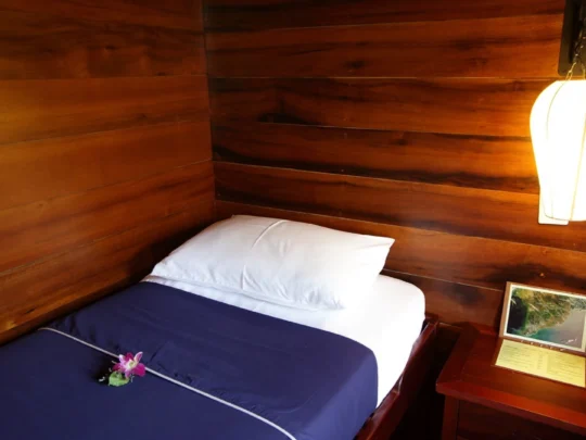 Mekong Smile Bassac Cruise Can Tho cozy cabin bedroom on Bassac Cruise