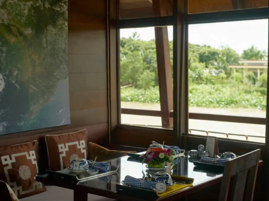 Mekong Smile Bassac Cruise Can Tho Cai Be cabin dining area with river view on Bassac Cruise