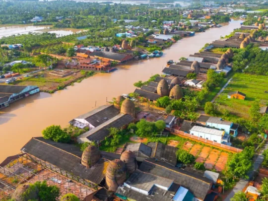 Mekong Smile Bassac Cruise Can Tho Cai Be Cai Be riverside village and Mekong Delta landscape aerial view
