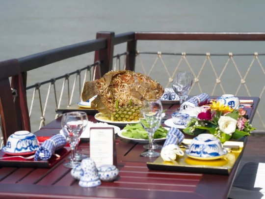 Mekong Smile Bassac Cruise Can Tho Cai Be dining served on Bassac Cruise deck on Mekong River