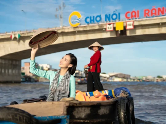 Mekong Smile Bassac Cruise Can Tho tourists visiting Cai Rang floating market by boat
