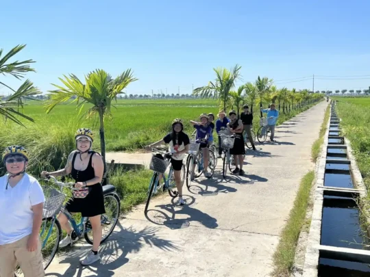 Mekong Smile Bassac Cruise Can Tho tourists cycling through Mekong countryside