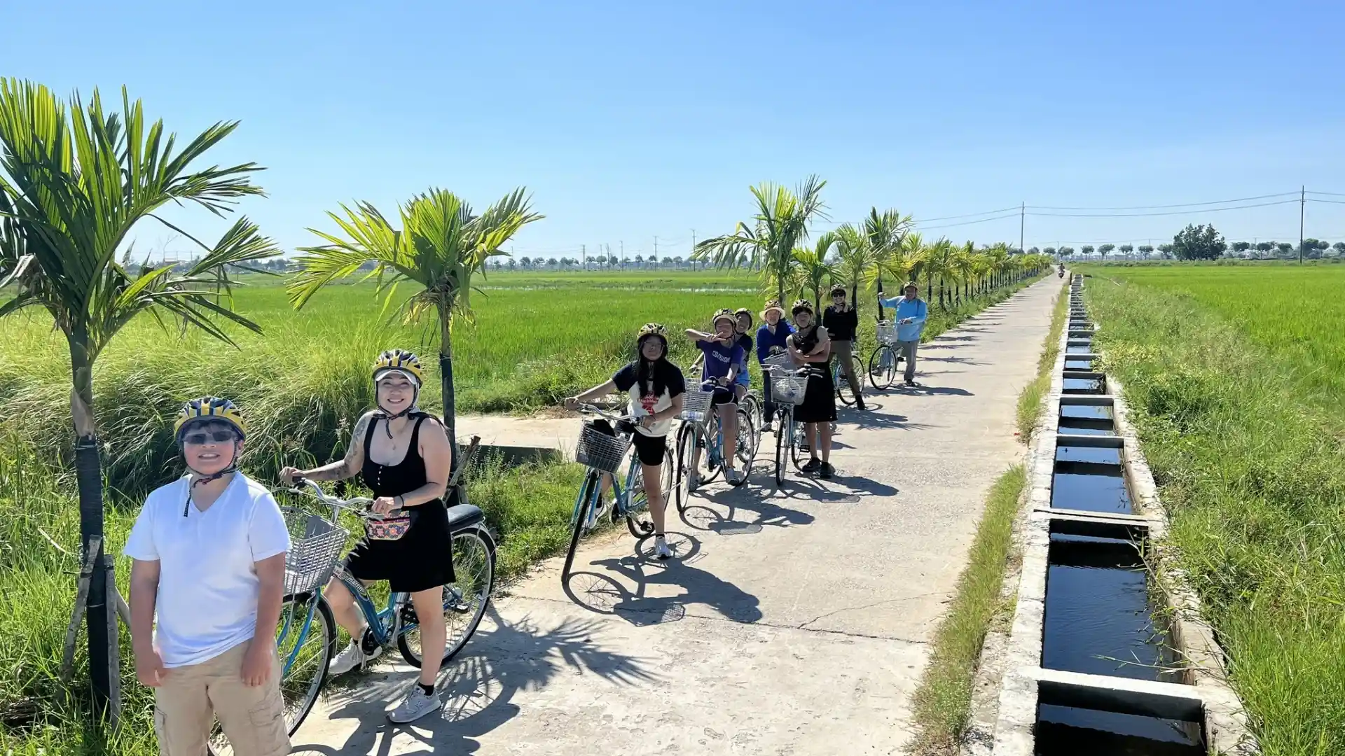 Mekong Smile Bassac Cruise Can Tho tourists cycling through Mekong countryside