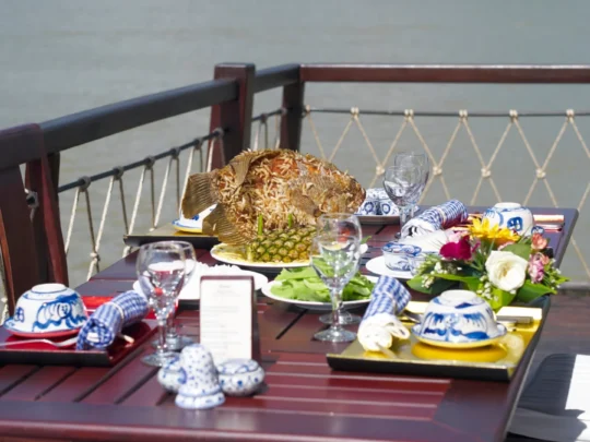 Mekong Smile Bassac Cruise Can Tho dining on deck with Mekong River view on Bassac Cruise