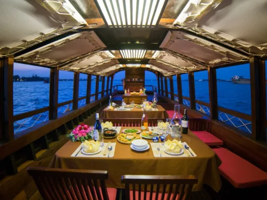 Luxury dinner soiree on Bassac Cruise during sunset in Can Tho
