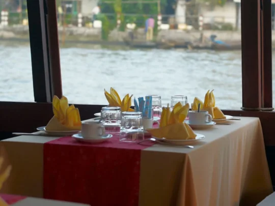 Private dining table on Bassac Cruise overlooking the Hau River in Can Tho