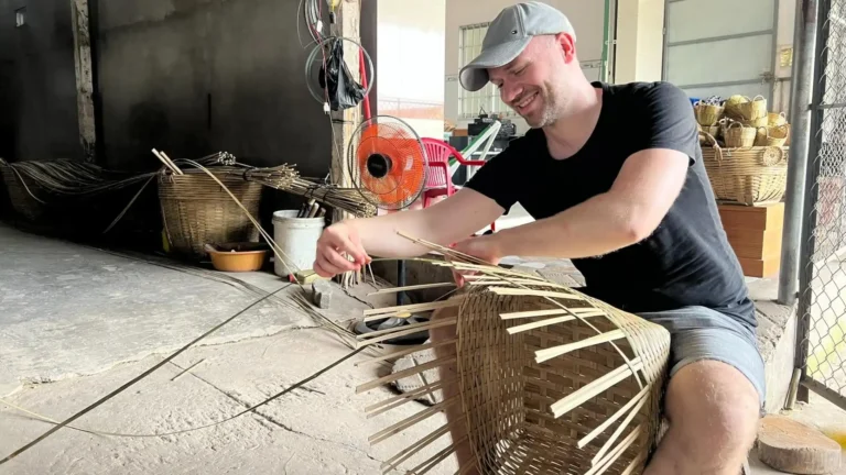 A traveler making a bamboo basket in Cai Be