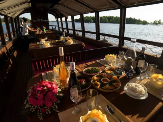 Vietnamese dinner set on Bassac Cruise during a Mekong sunset cruise in Can Tho