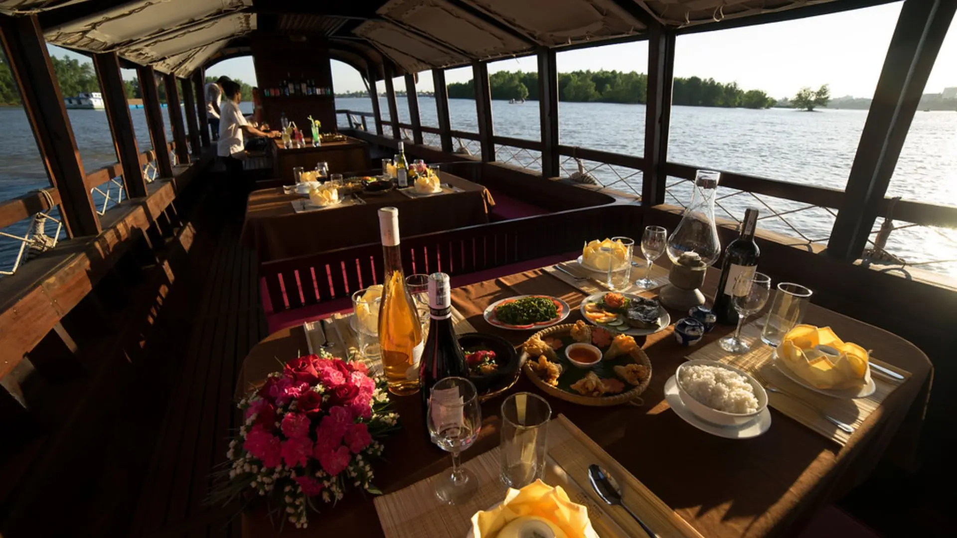 Vietnamese dinner set on Bassac Cruise during a Mekong sunset cruise in Can Tho