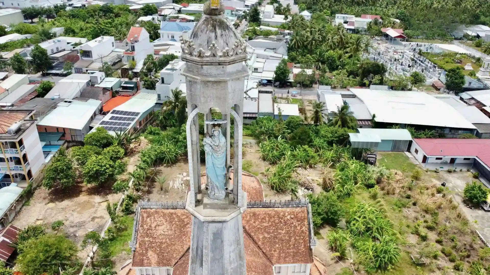 Aerial close-up of Cai Be Church bell tower in Cai Be, Tien Giang, Vietnam