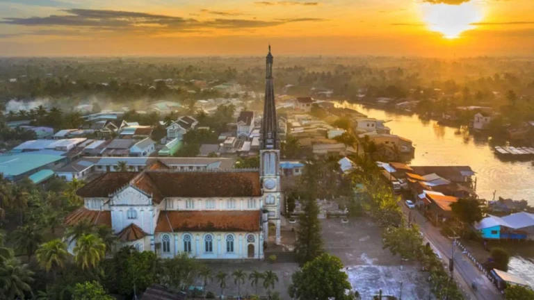 Sunset view of Cai Be Church in Cai Be, Tien Giang, Vietnam with Mekong Delta landscape