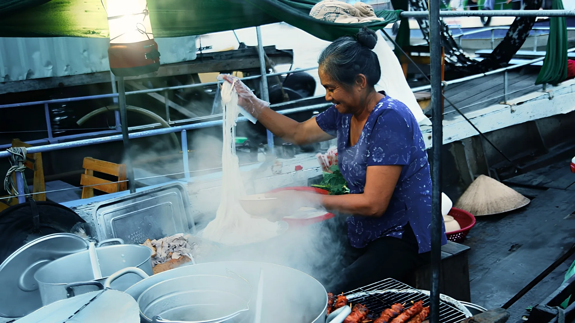 Mekong Smile Cai Be Floating Market breakfast on boat with local vendors serving traditional Mekong dishes