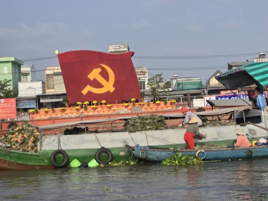 Cai Rang Floating Market in Can Tho with boats trading goods on the Mekong River at sunrise