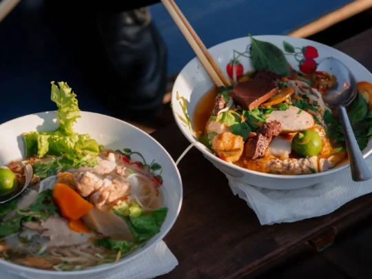 Vietnamese breakfast dishes served on boats at Cai Rang Floating Market, Mekong Delta