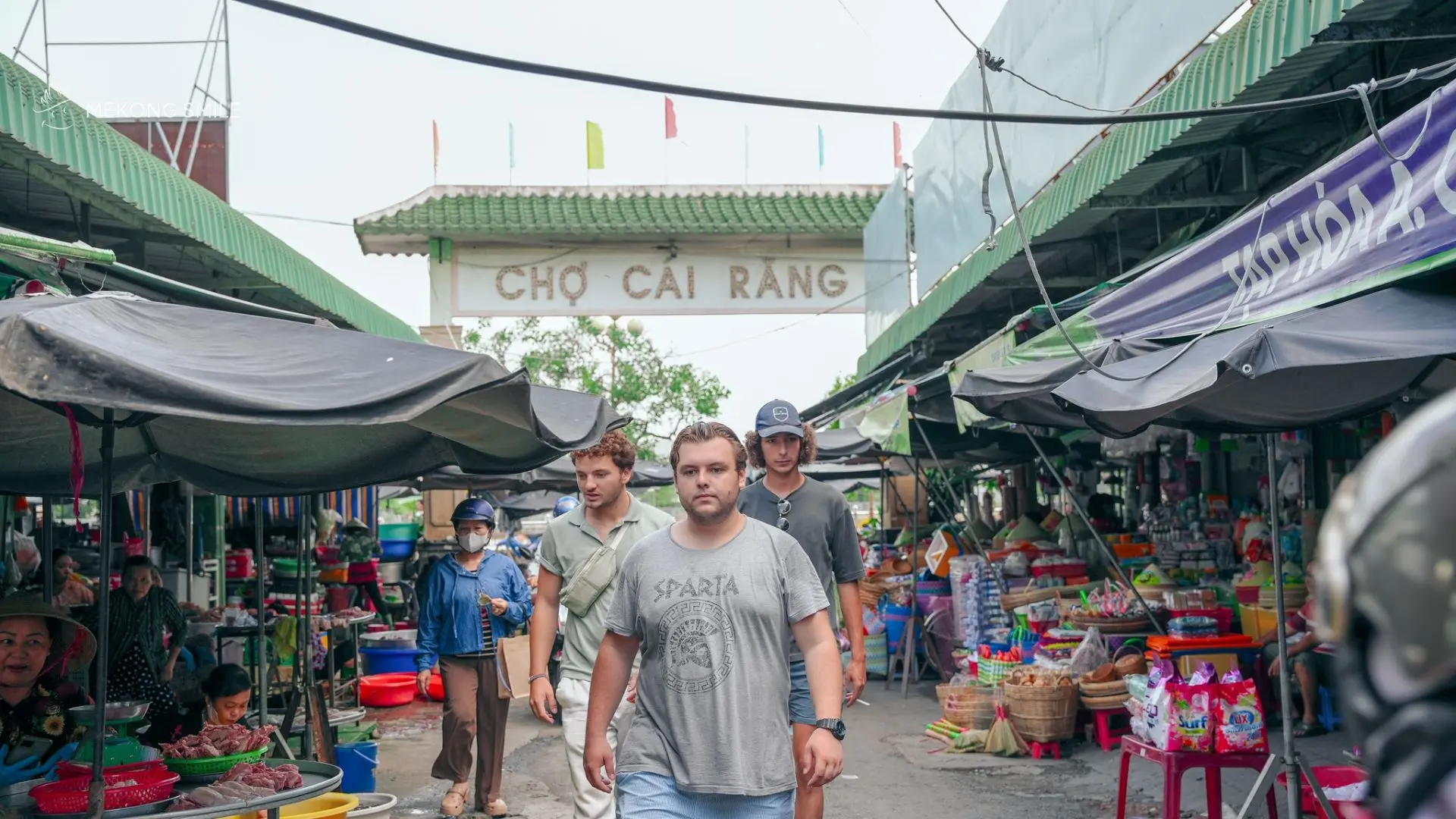 Riverside market near Cai Rang Floating Market with local shops and daily life scenes