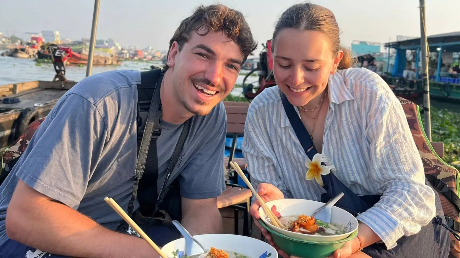 Tourists enjoying local food at Cai Rang Floating Market in Can Tho