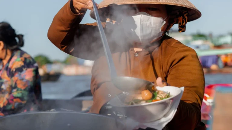 Traditional Vietnamese noodle soup prepared on a boat at Cai Rang Floating Market