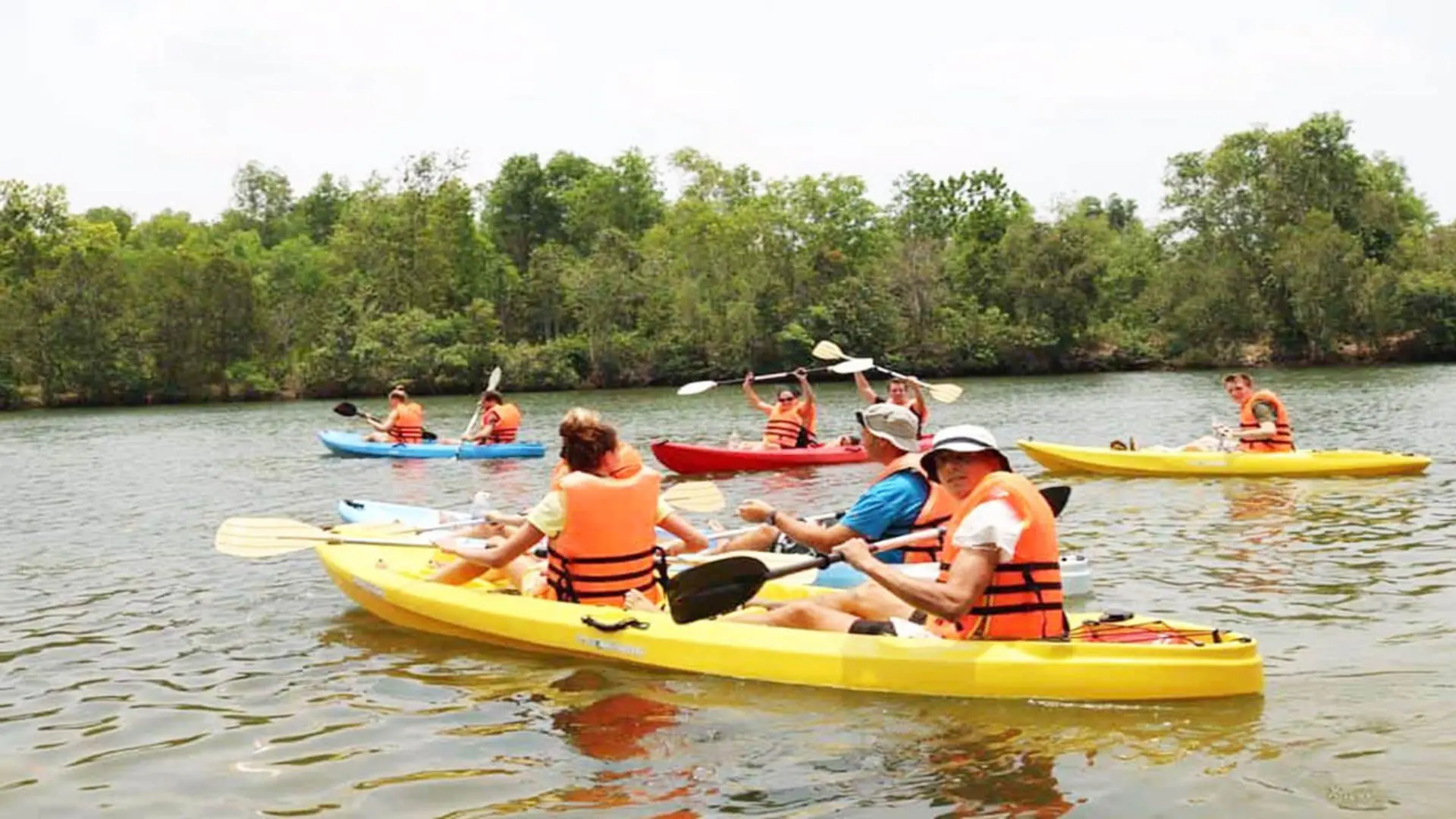 Tourists kayaking on the river near Can Tho beach