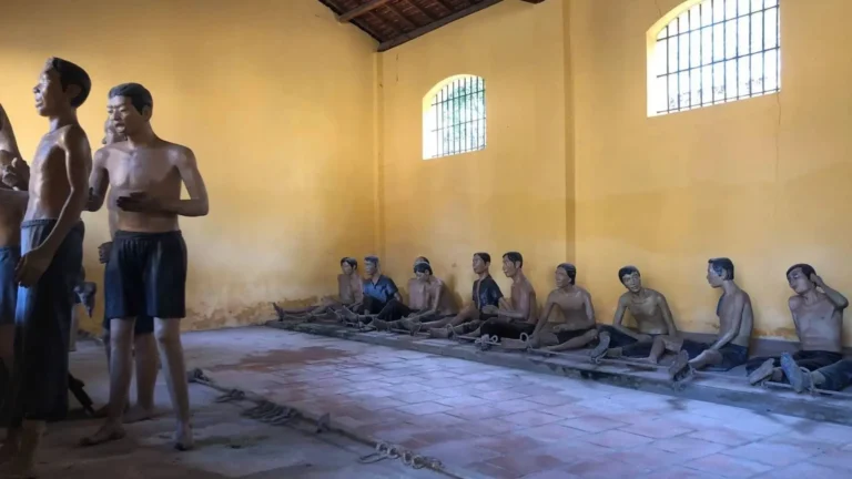 Former detention room inside Can Tho Prison with prisoners’ statues