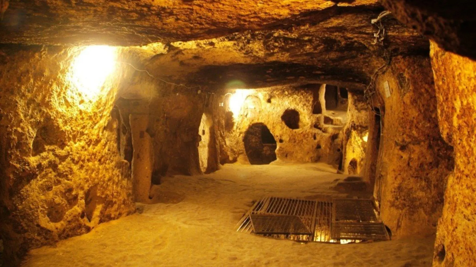 Close-up of the rough, compacted earth and clay structure inside the tunnel in Cu Chi Tunnels Tour