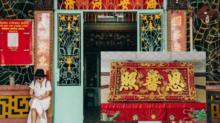 Red and gold calligraphy plaque at Dieu Hoa Temple
