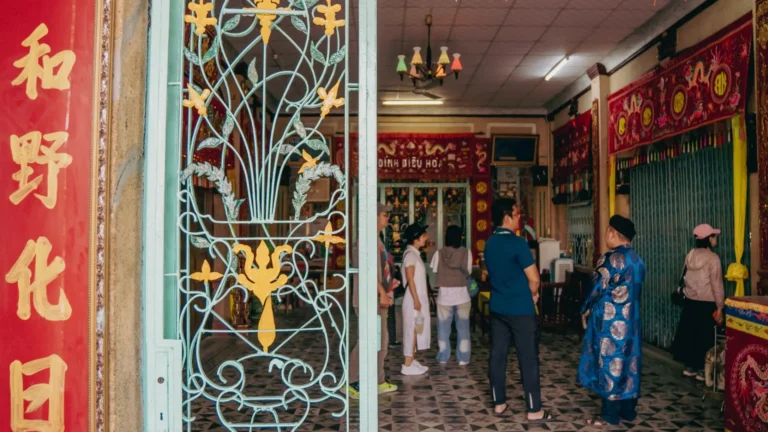 Visitors inside the historic Dieu Hoa Temple