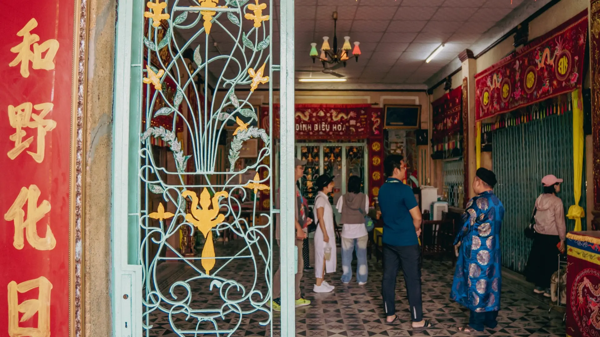 Visitors inside the historic Dieu Hoa Temple