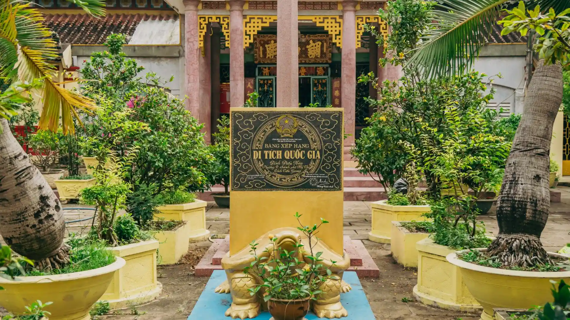 Garden stele and greenery at Dieu Hoa Temple