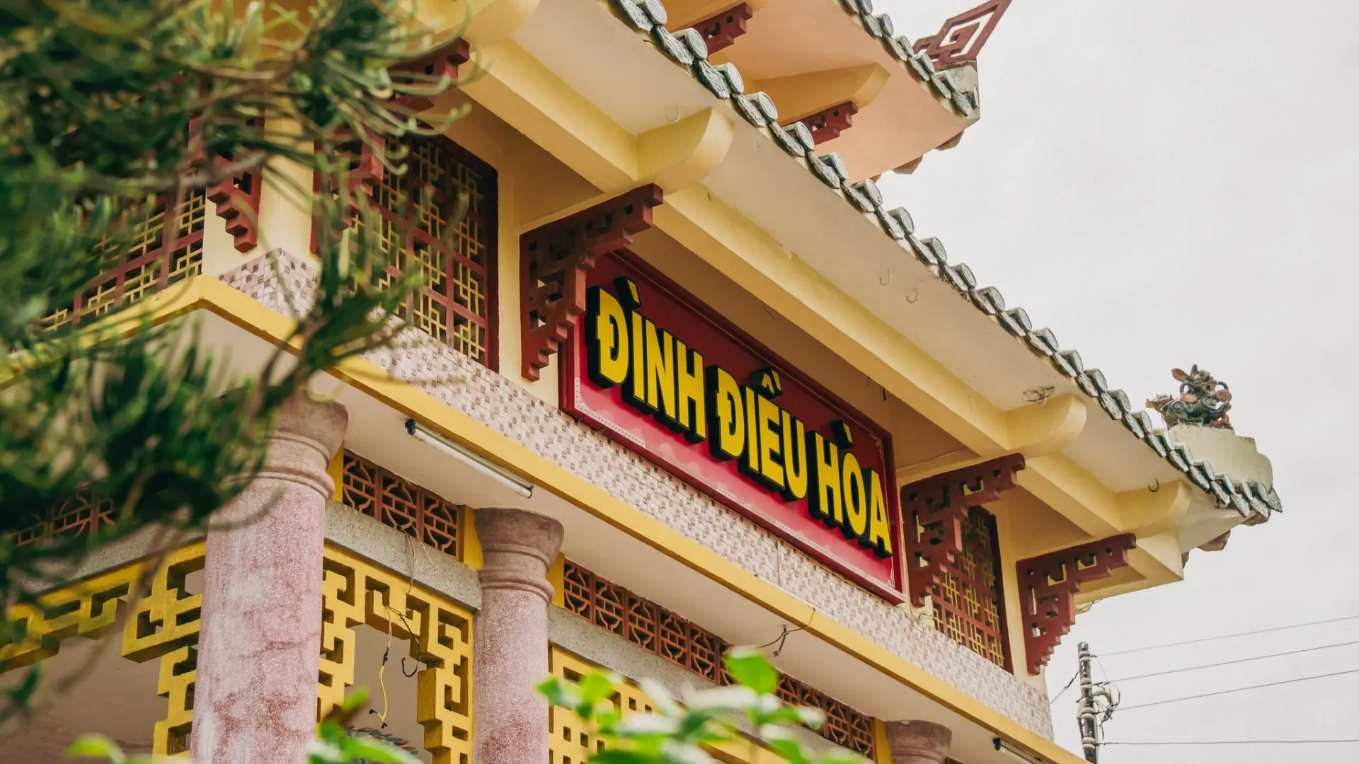 Exterior signage board at Dieu Hoa Temple facade