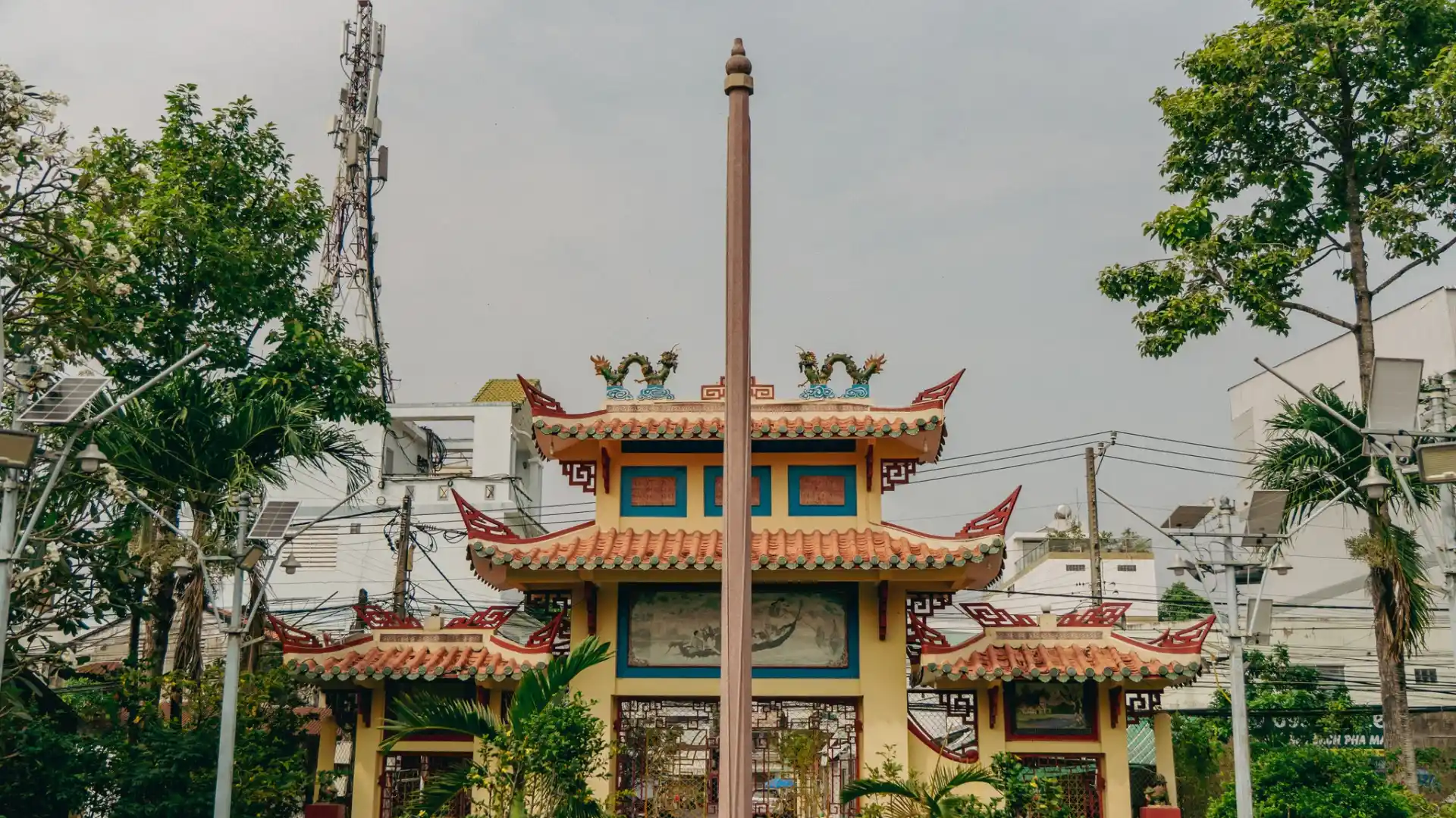 Distant view of Dieu Hoa Temple entrance and pillars