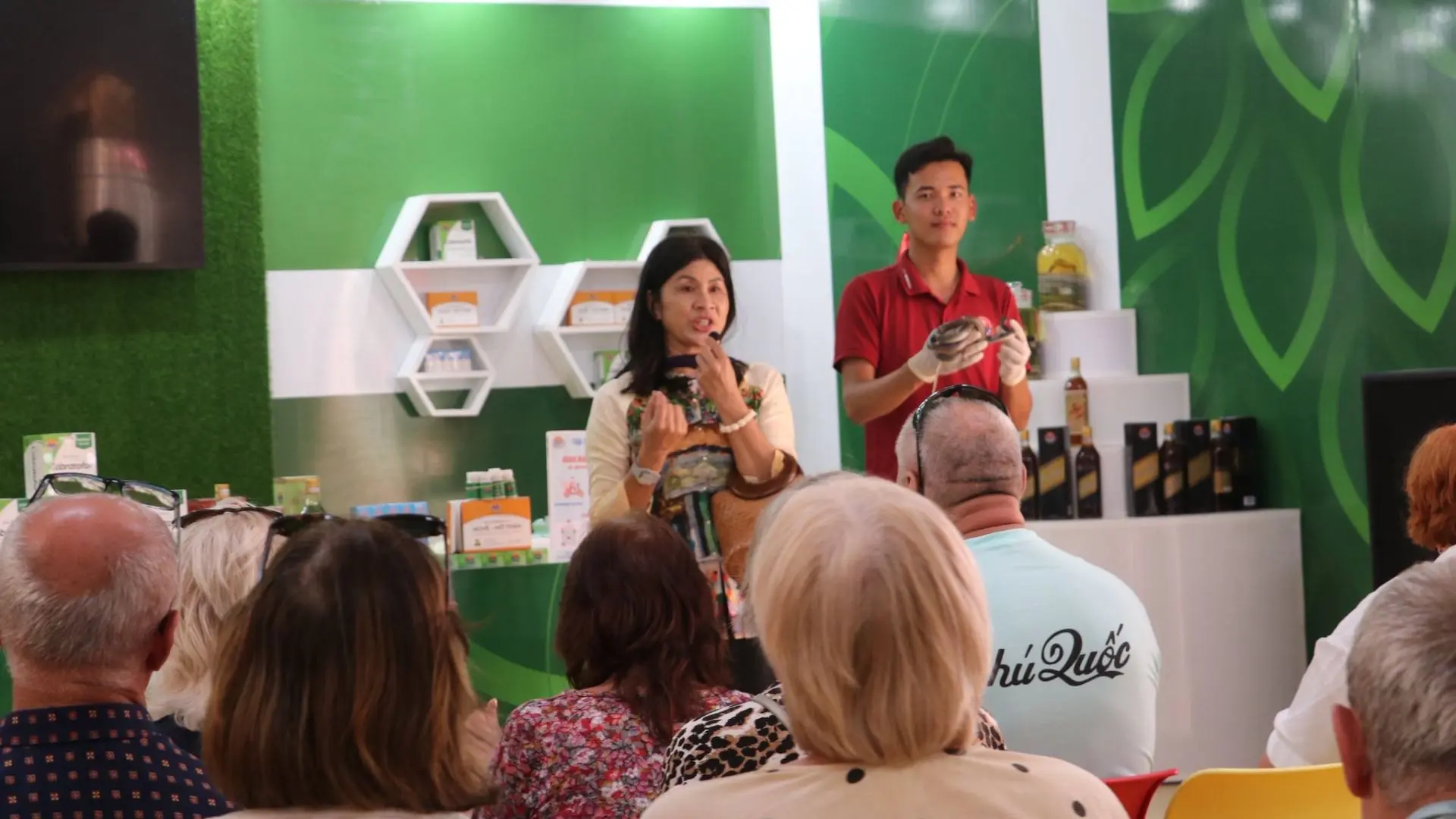 Tourists attending an educational talk about snakes and conservation at Dong Tam Snake Farm in Tien Giang