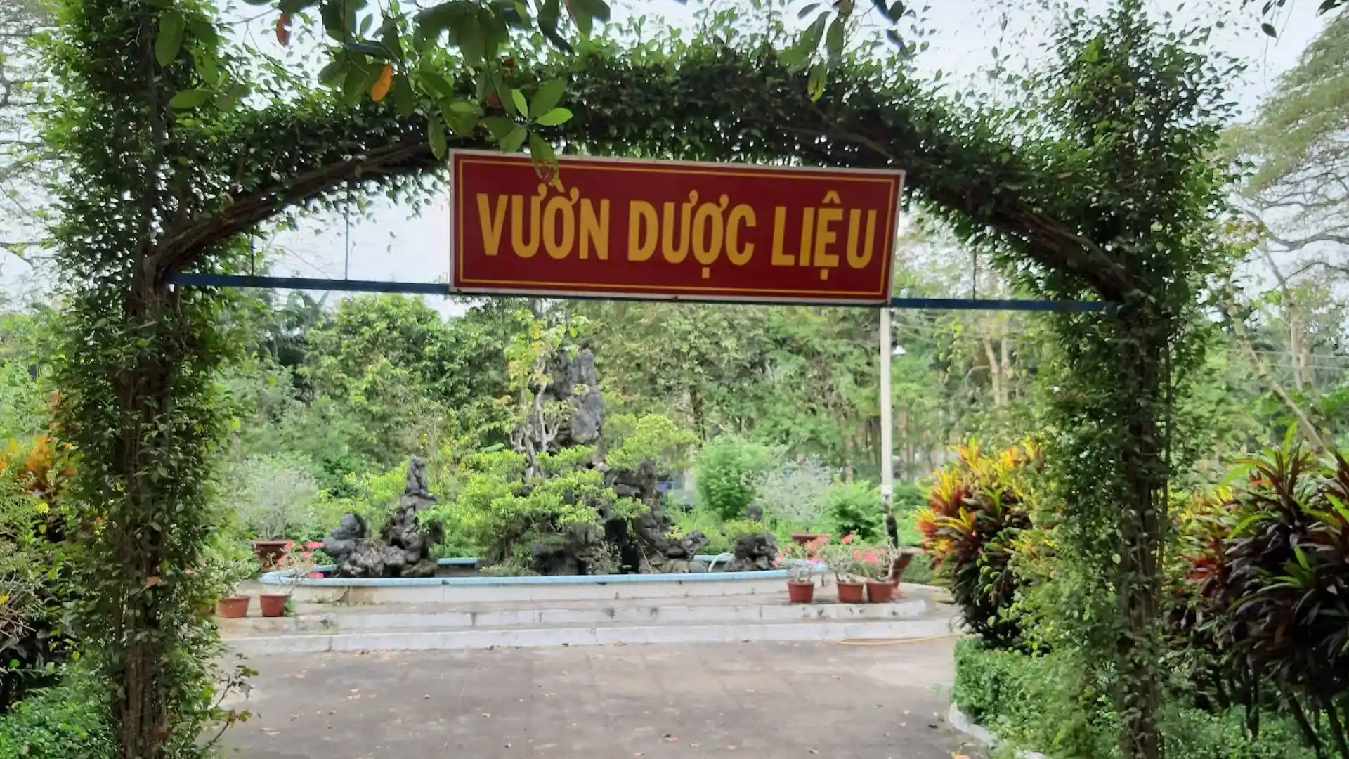 Entrance to the medicinal herb garden at Dong Tam Snake Farm in Tien Giang, Vietnam, featuring plants used in traditional medicine