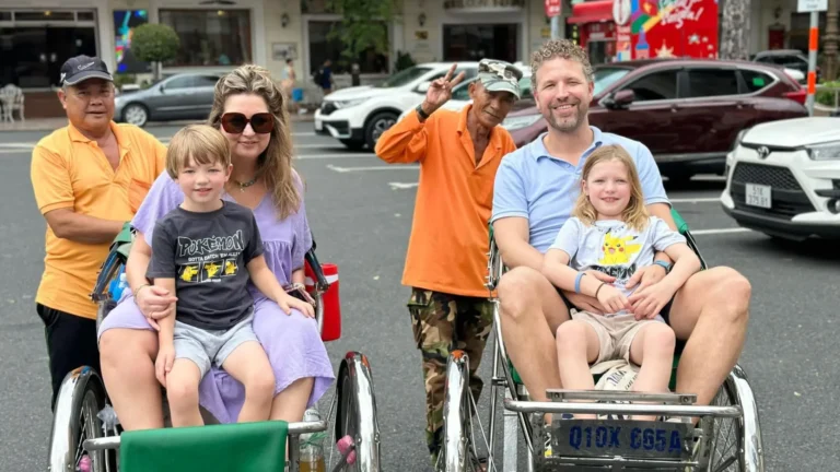 Family enjoying a cyclo ride on Ho Chi Minh Cycle Tour in Ho Chi Minh City