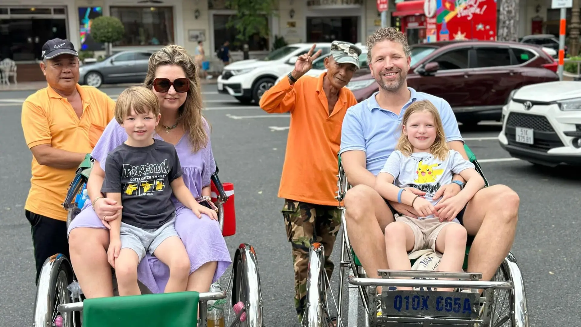 Family enjoying a cyclo ride on Ho Chi Minh Cycle Tour in Ho Chi Minh City