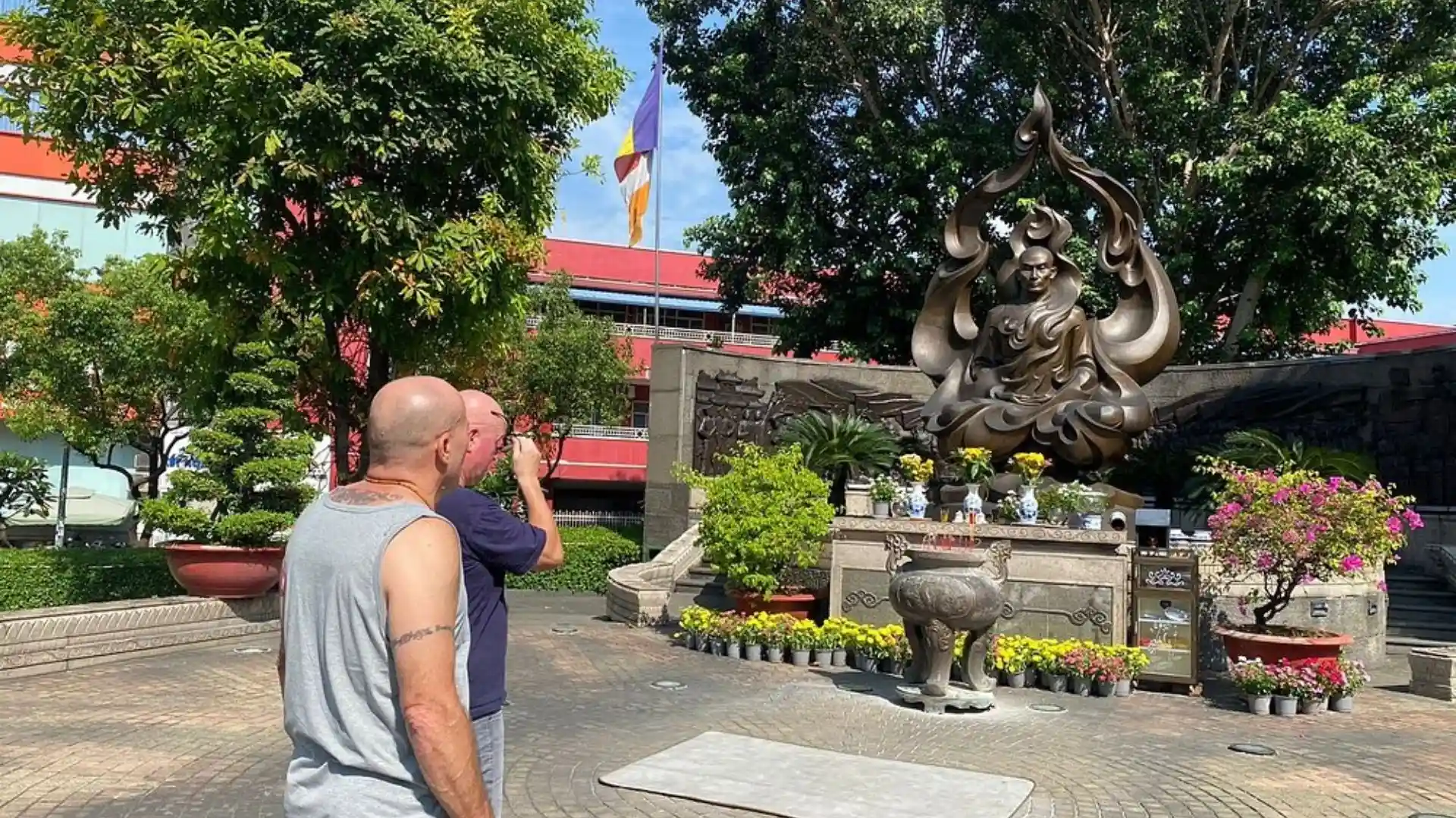 Tourists at the Burning Monk Memorial on Ho Chi Minh motorbike tour