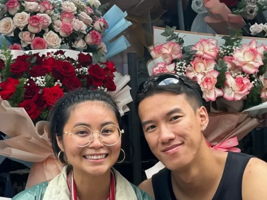 Tourists visiting a local ho thi ky flower market during Ho Chi Minh City motorbike tour