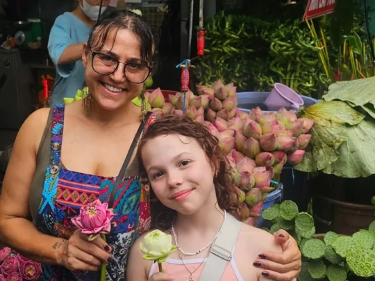Travelers experiencing a traditional ho thi ky flower market in Ho Chi Minh City