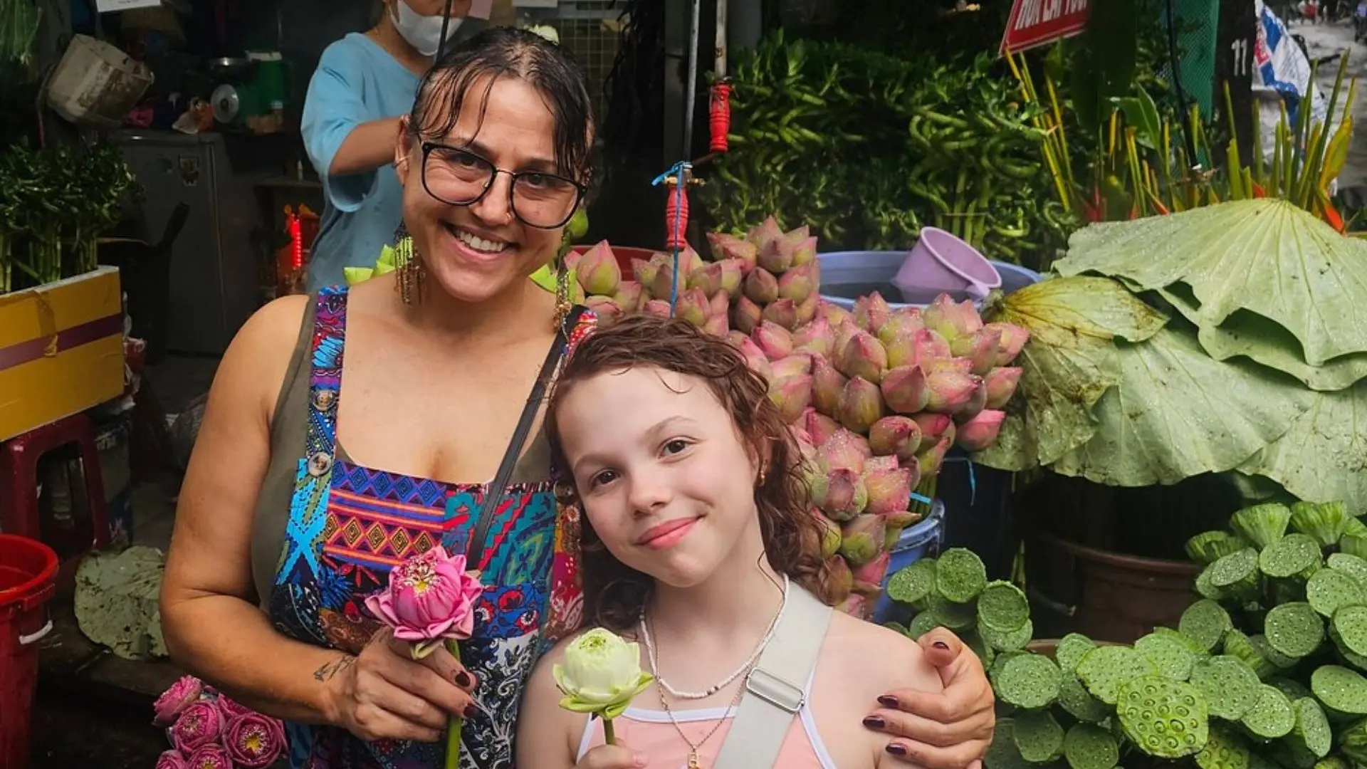 Travelers experiencing a traditional ho thi ky flower market in Ho Chi Minh City