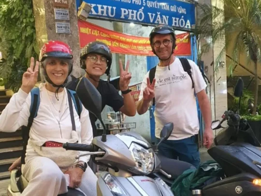 Tourists riding motorbikes with local guides during Ho Chi Minh motorbike tour in Saigon