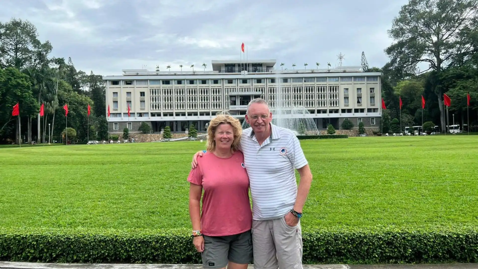 Tourists visiting Reunification Palace during Ho Chi Minh City motorbike tour