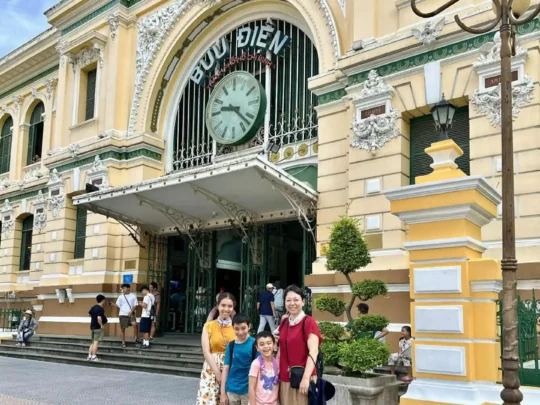 Tourists at Saigon Central Post Office during Ho Chi Minh motorbike city tour