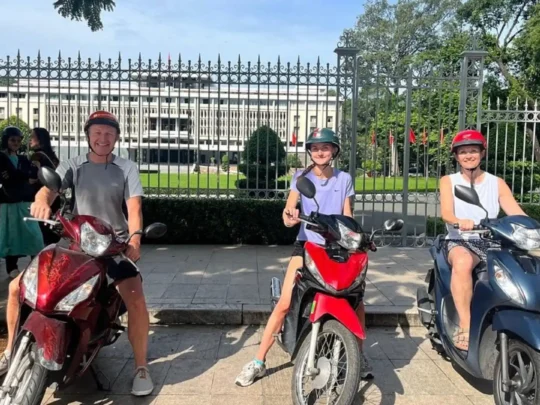 Tourists riding motorbikes during Ho Chi Minh City motorbike tour