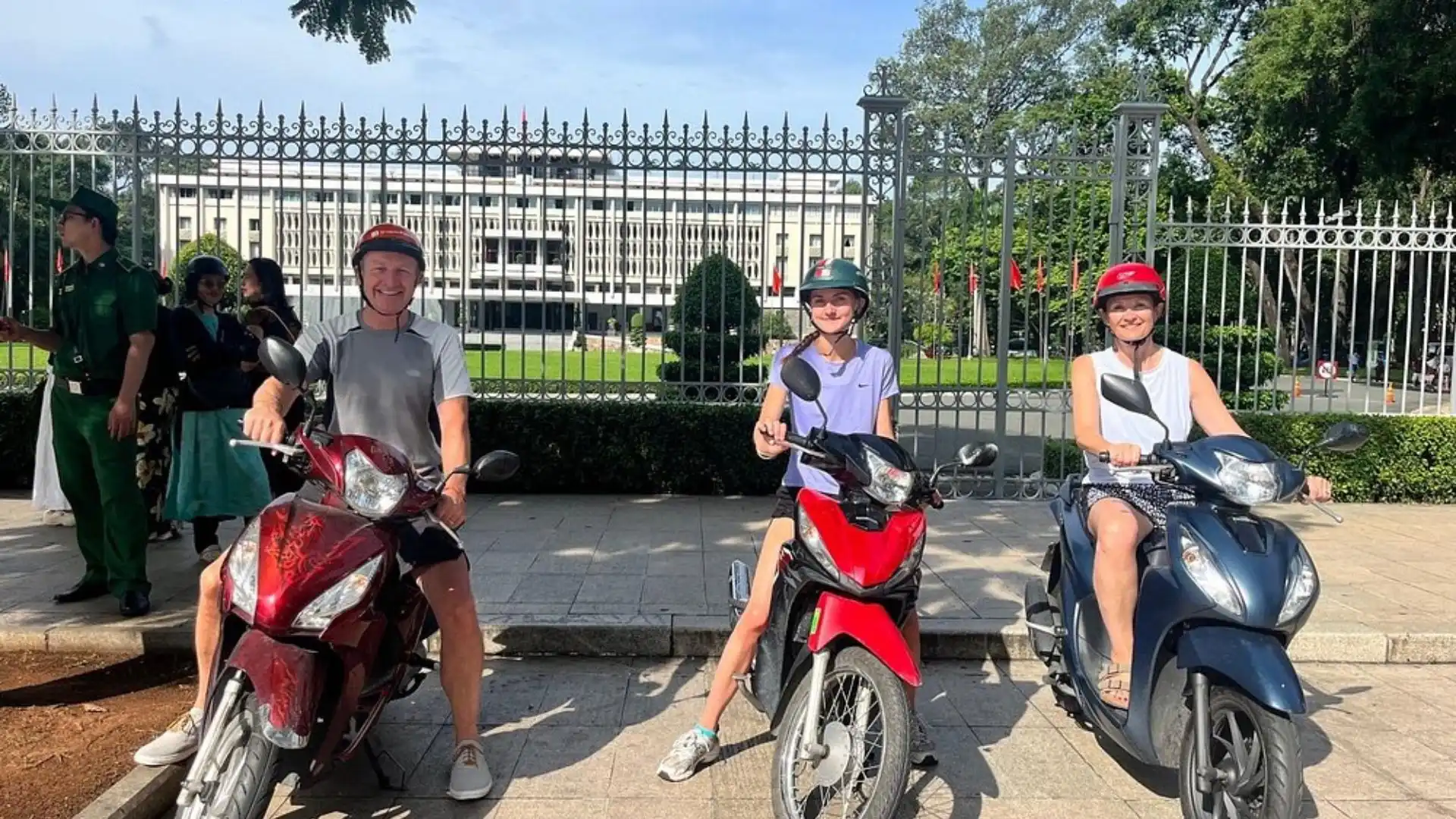 Tourists riding motorbikes during Ho Chi Minh City motorbike tour