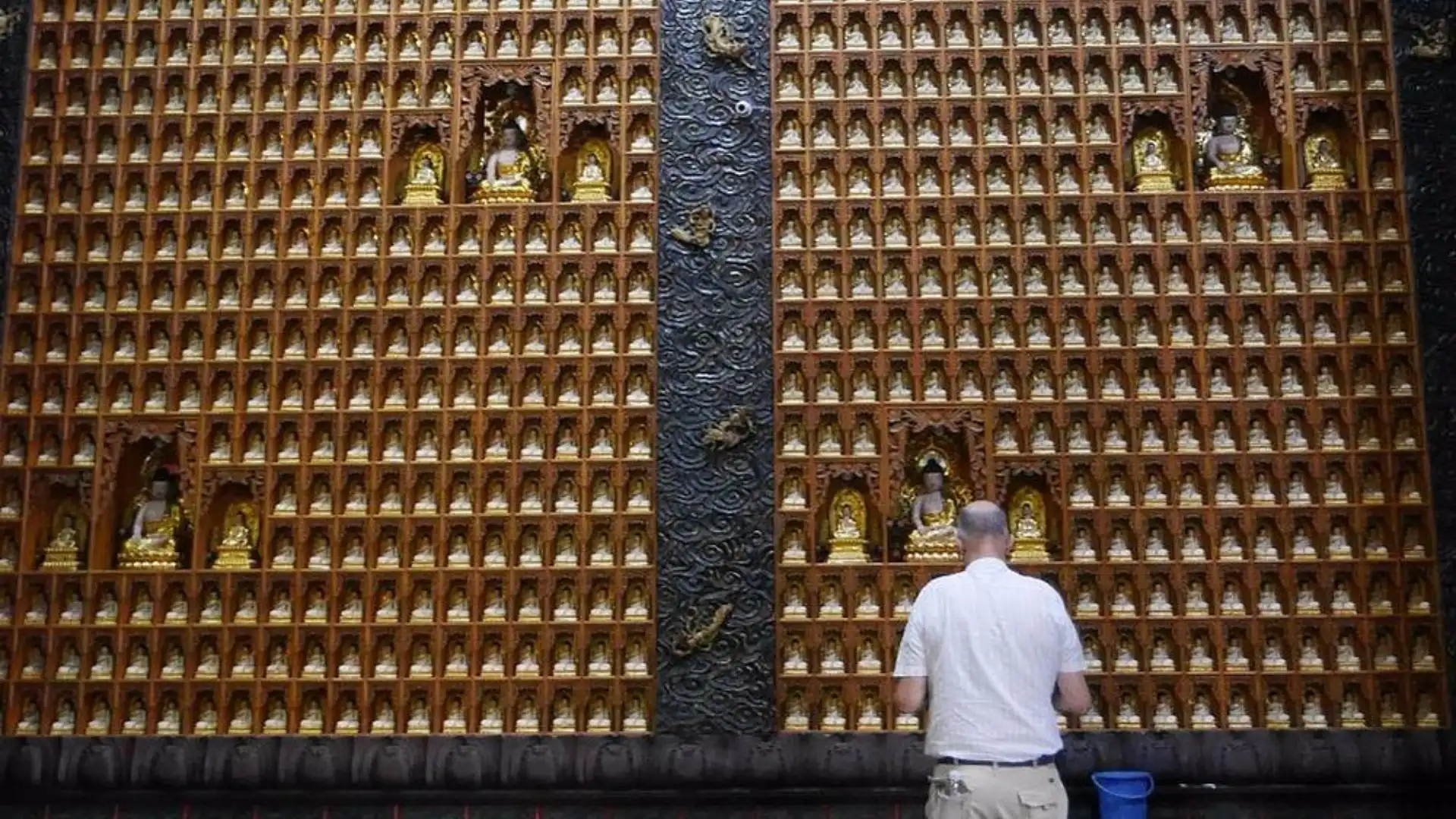 Visitor praying at Ten Thousand Buddha Pagoda on Ho Chi Minh motorbike tour
