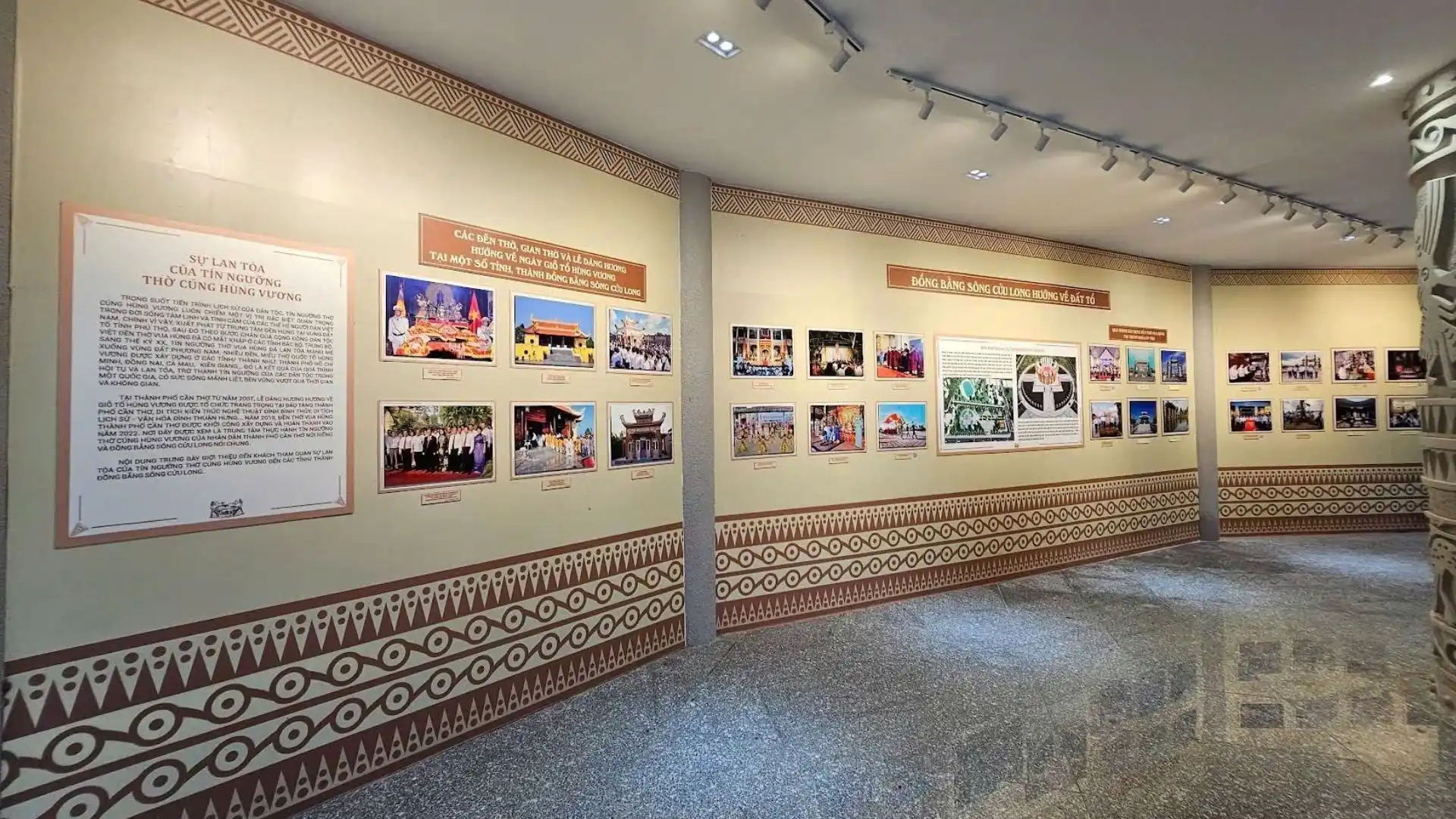 Photo gallery corridor with framed images and text panels at Hung King Temple Can Tho