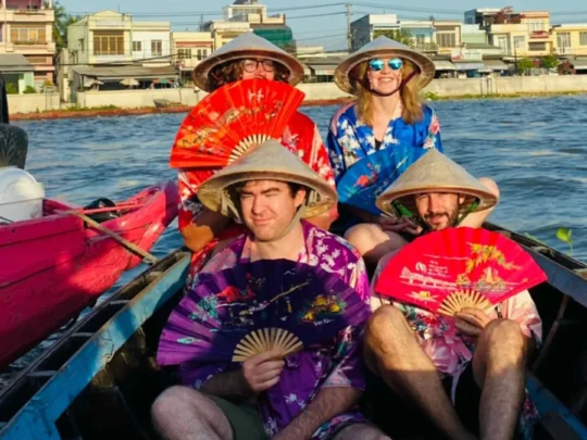 Tourists visiting floating market in Mekong Delta during 2 days