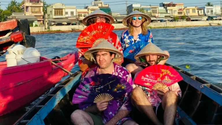 Tourists visiting floating market in Mekong Delta during 2 days